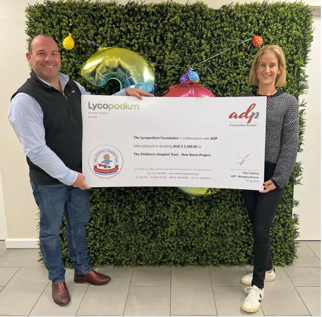 ADP Managing Director Toby Lambooy presents the cheque to Taryn Rubenstein, Donor Relationship Manager for The Children’s Hospital Trust